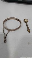 Bracelet and spoon side by side showing overall design and scale