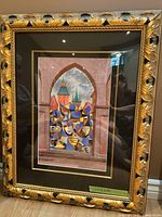 Full view of framed print showing artwork, mat and ornate frame