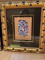 Front view showing artwork, mat, frame, and glass