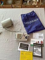 Full view of monitor, cuff, bag and paperwork