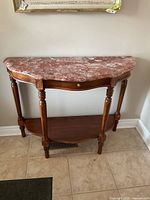 Front view of marble-top hall table