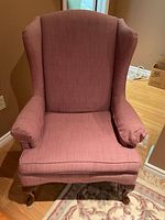 Front view of pink wingback accent chair