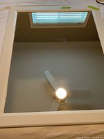 Full view of rectangular mirror with white frame