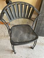 Single chair showing slatted back, mesh seat and curved arms