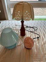 Wood base lamp, blue lamp, Himalayan salt lamp on table