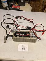 Full view of NOCO Genius G7200 charger with attached cables and clamps