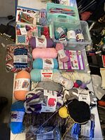 Overview of yarn skeins, books, organizer tray