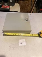 Closed key box with keys on lock, tape for scale