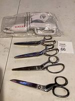 All five scissors displayed including packaged Singer scissor