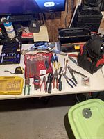 Overview of assorted hand tools spread on table