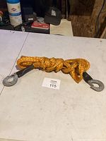 Tow rope coiled on table showing one hook clearly