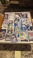 Full box showing thousands of baseball cards spread across divider rows with colourful parallels on top