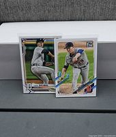 Front view of both rookie cards in sleeves
