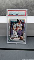 Front view of PSA-slabbed Heston Kjerstad 2020 Bowman Draft Chrome Refractor card showing PSA 9 grade label