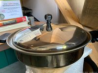 Stock pot with lid side view showing exterior finish and handles
