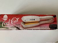 Retail box showing Cool Cat hair crimper image and branding