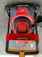 Top view showing Homelite branding and 20-inch deck marking