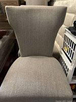 Front view of light gray fabric accent chair showing seat and backrest