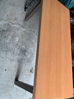 Top angled view showing full tabletop and two legs