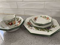 Group showing teacup, bowl and stacked plates