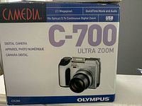 Retail box showing Olympus Camedia C-700 Ultra Zoom branding and specifications