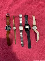 Front view of five wristwatches side by side