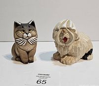 Front view of cat and dog figurines