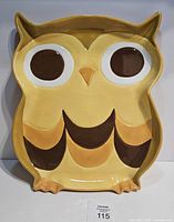 Front view of owl-shaped platter showing overall design and colors