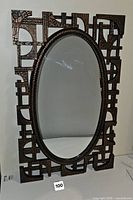 Front view showing mirror and ornate frame