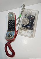 Phone base and handset front view showing keypad and cords