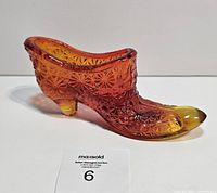 Left side of Amberina glass shoe showing color gradient and starburst pattern