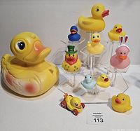 Group shot of blow-mold duck, rubber ducks, Hot Wheels car