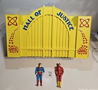 Front view of Hall of Justice façade with Superman and Flash figures
