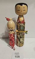 Front view of both kokeshi dolls