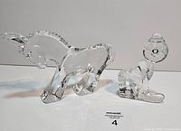 Front view of donkey and clown figurines side by side