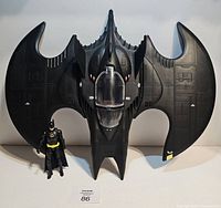 Front view of Batwing with Batman figure for scale