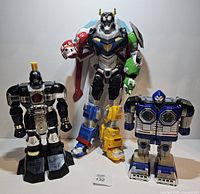 Front view of three robot figures