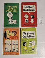 Front covers of four Peanuts paperbacks