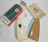 Both metronomes, box, instructions shown together