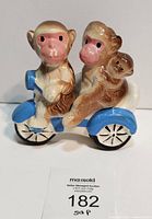 Front view of both monkey shakers assembled on tricycle