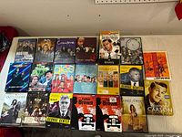 Full lot overview on table, showing 18 DVD sets