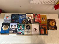 Overview of all thirteen DVD sets on table