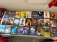 Wide shot showing entire assortment of DVDs spread on table