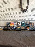Full lot overview showing all DVD cases and box sets on table