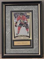Full view of framed Chris Phillips hockey card with matting and nameplate