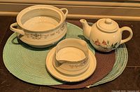 Serving bowl, gravy boat with underplate and teapot grouped