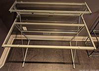 Desk overall top view showing glass surfaces and metal frame