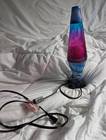 Lamp upright showing globe, base, cord and inline switch