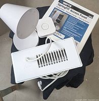 Group shot showing SmartThings Hub, white LED desk lamp, Cyclone powered vent cover with cord, and packaged Watts 8x8 access panel