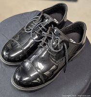 Pair of black polished cap toe dress oxfords with laces